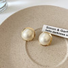 Design metal earrings from pearl, trend of season