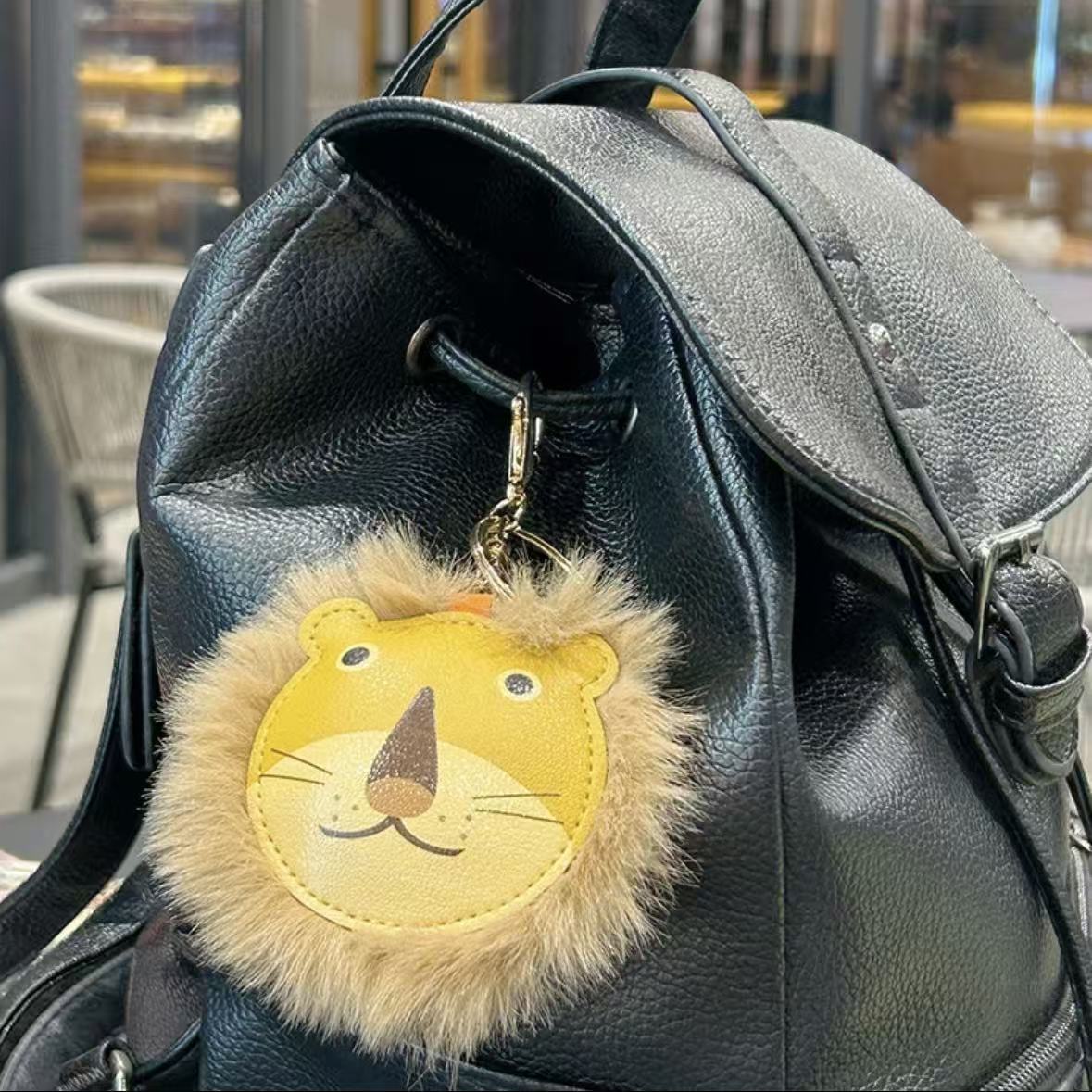 Transfronterizos peluche extraño león llavero de cuero bolsos de pareja colgante lindo llavero de automóvil pequeño regalo