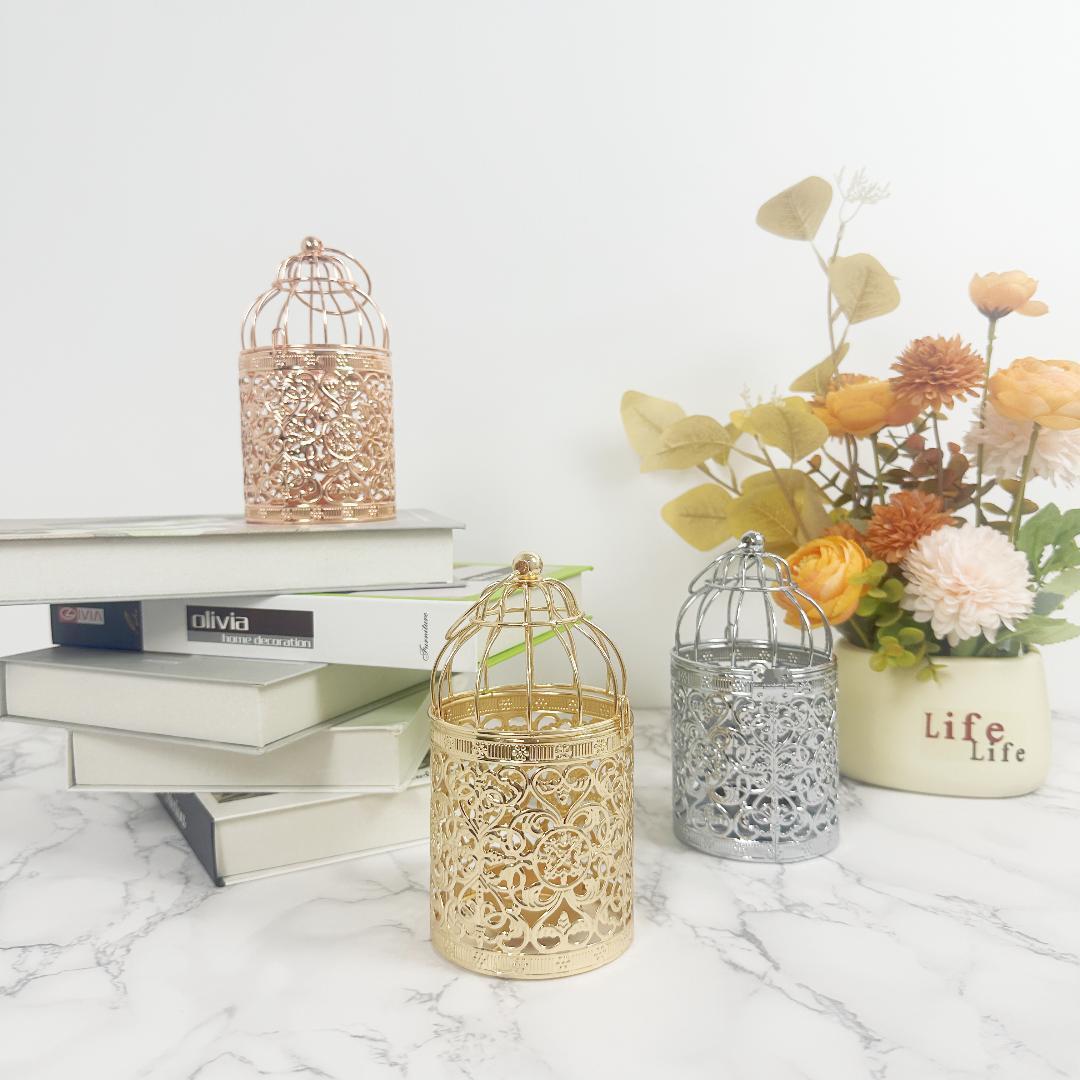 Artefactos metálicos galvanizados de oro transfronterizos europeos creativos en forma de jaula de pájaros candelabros adornos para el hogar accesorios de boda al por mayor