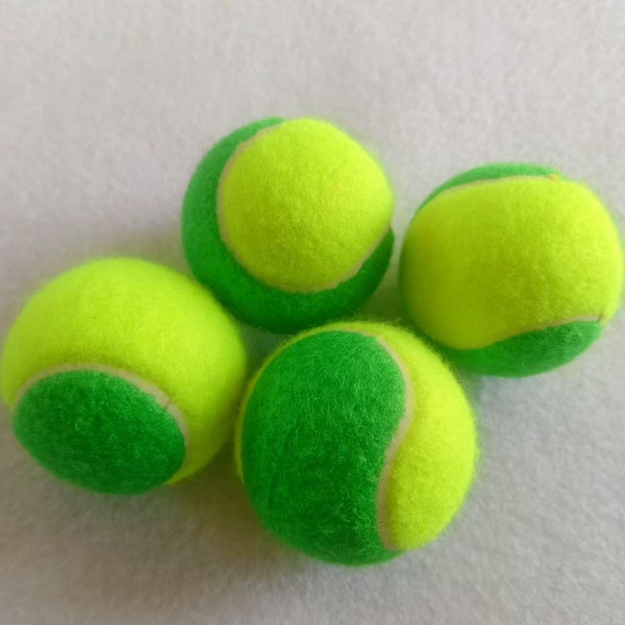 Children's Green Tennis Ball Opens up Fun Outdoor Sports Time. Cute Baby Loves High-Quality Tennis Balls