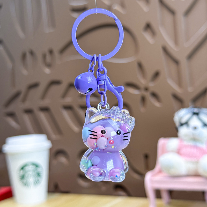 Caricatura en aceite líquido arena flotante botella mochila llavero delicado colgante accesorios accesorios máquina de muñecas pequeños regalos al por mayor