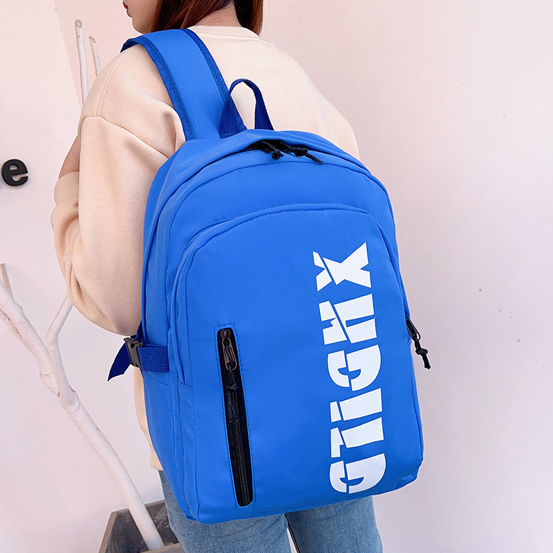 Mochila de moda de moda para hombres 2023 nueva mochila de hombro femenina de gran capacidad de letras de escuela secundaria mochila escolar