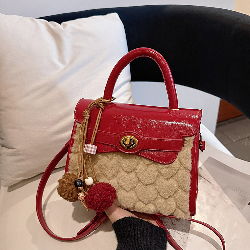 Otoño y invierno de alto nivel bolso de lana portátil para mujeres 2025 nuevo nicho Zhong commuting bolso de hombro bolso casual Kelly