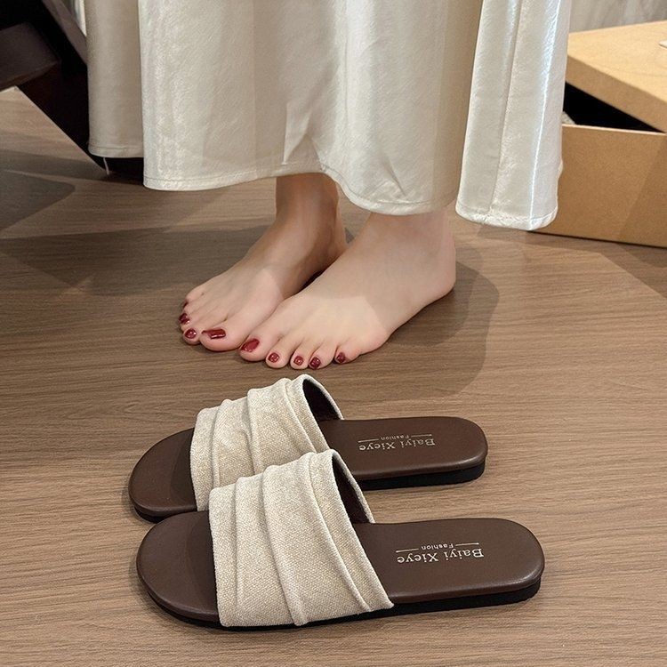 Nicho francés pliegue zapatillas planas de verano para mujeres 2026 nuevas zapatillas de playa de vacaciones