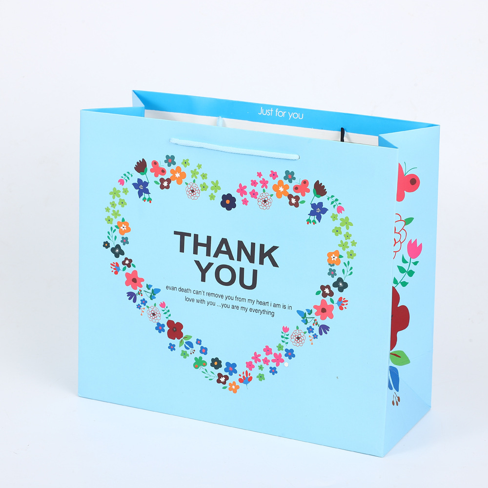 Bolsa de regalo Lindo bolso de cartón blanco impreso LOGO embalaje bolso de dibujos animados regalo de mano al por mayor bolsa de regalo de boda