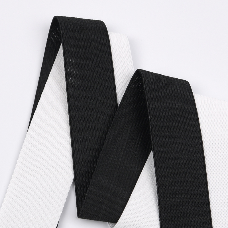 Elastic white knitted trousers, wholesale, on elastic band