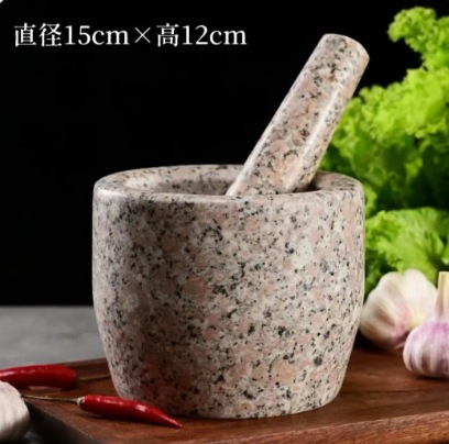 un cilindro de piedra negra tipo molino de piedra de grasa