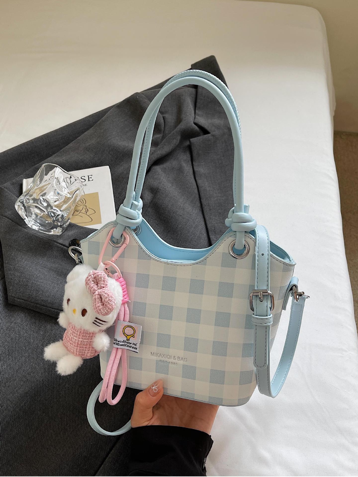 Bolsa de cubo de nicho a cuadrillas 2025, nuevo bolso de mano transfronterizo versátil de alta calidad, mochila de hombro de moda