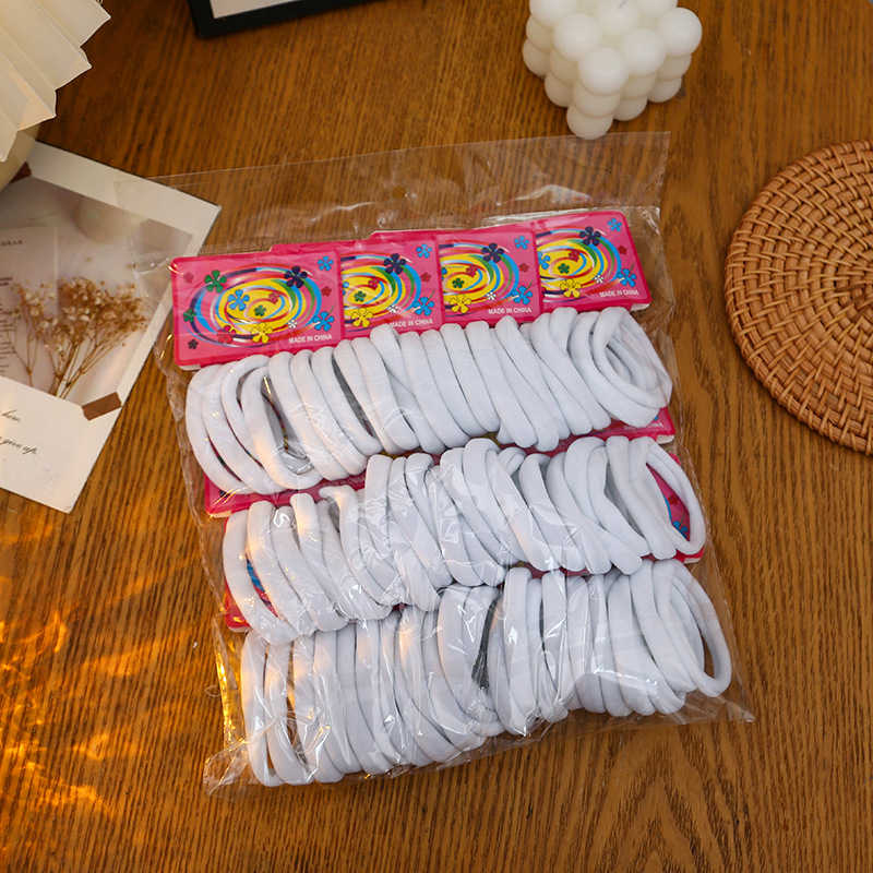 Ventas transfronterizas directas coreanas de alta elasticidad de color sólido no dañan la cuerda de cabello 72 bolsas de tarjeta de clavos sin costuras anillo de toalla anillo de cabello