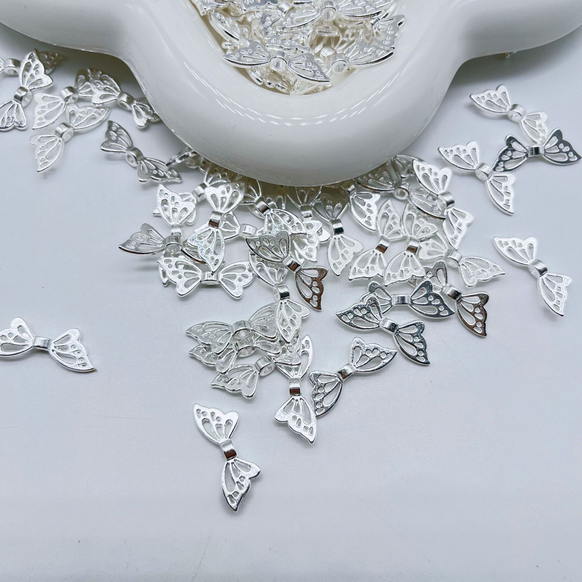 Net red metal butterfly nail jewelry simple diy hollow wholesale pendant wholesale