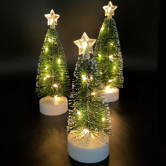 アマゾンのクリスマスパーティーのクリスマスの家の装飾の雰囲気はミニledの発光のクリスマスツリーを並べます。
