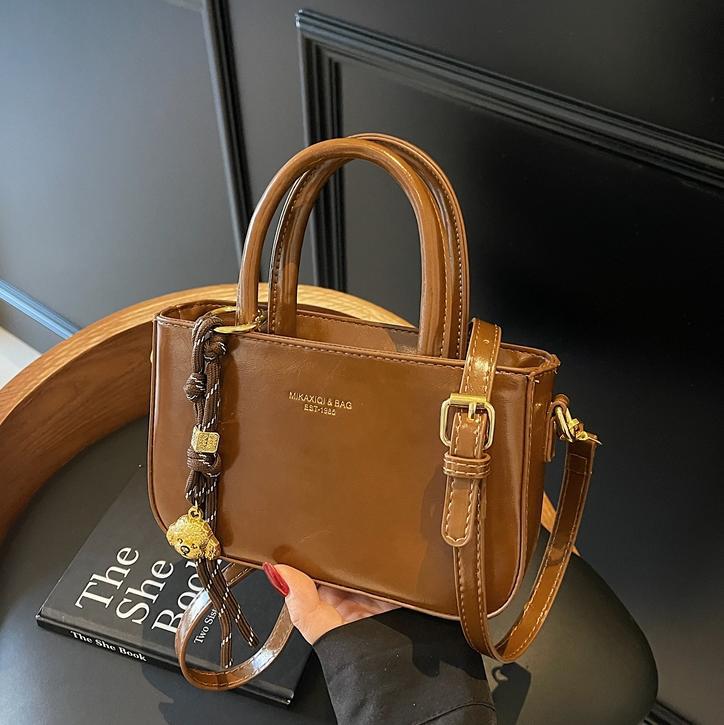 Transfronterizo simple bolso de mano ocio para mujeres 2025 nuevo bolso de hombro de moda retro popular bolso de mochila versátil