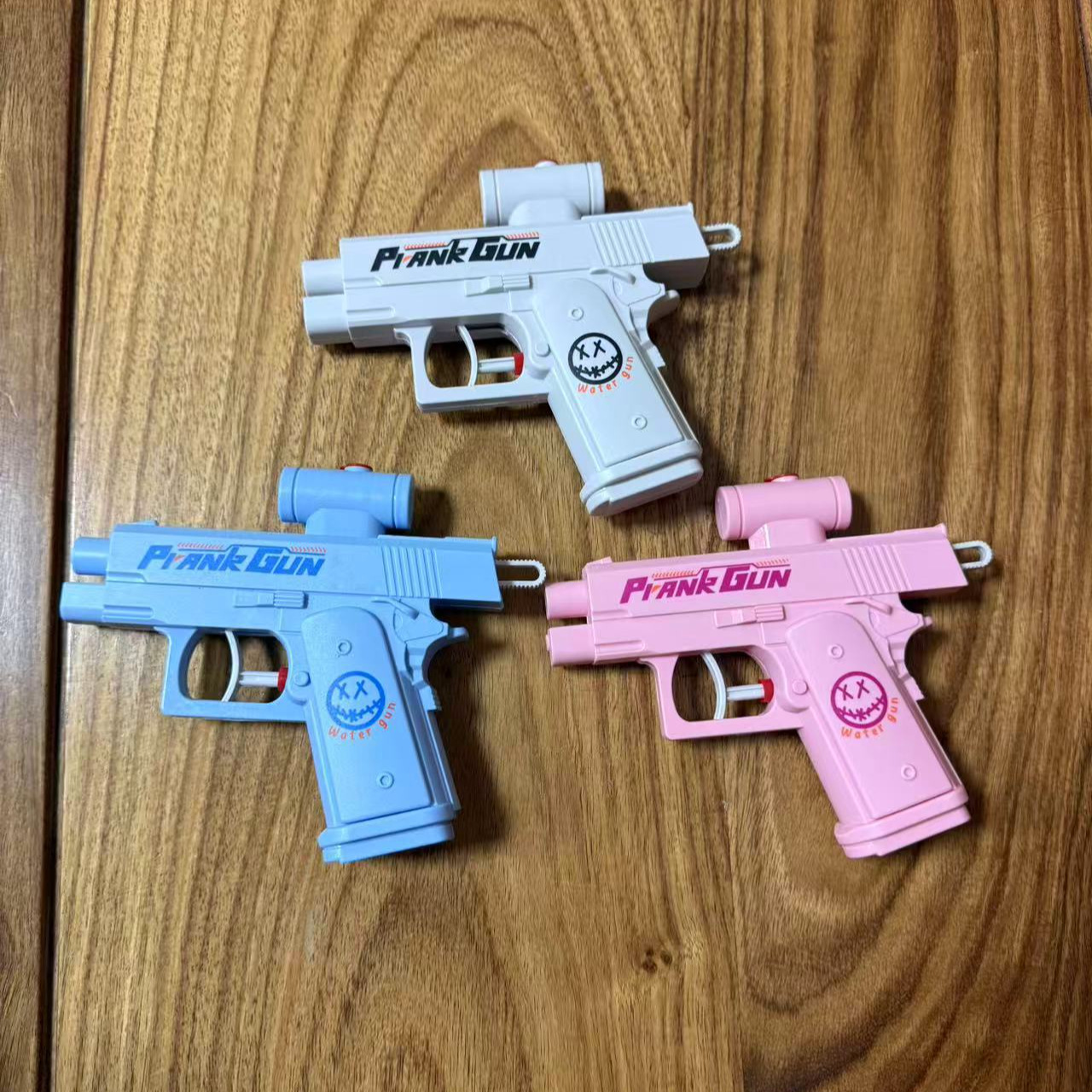 Pequeño libro rojo con la misma pistola de agua de dos caras He Chenguang creativo de la máquina de presión pistola de agua juguete táctica pistola de rociador de agua