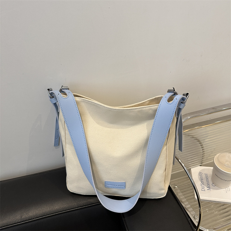 Bolso bandolera de lona de moda para mujer 2024 marea de otoño nuevo estilo de gran capacidad de costura de color de contraste viaje a clase bolso de viaje