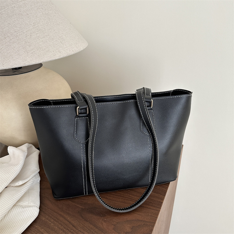 Bolso de viaje de alta gama retro 2025 primavera nuevo estilo salvaje ins color sólido bolso de hombro de trabajo bolso Tote