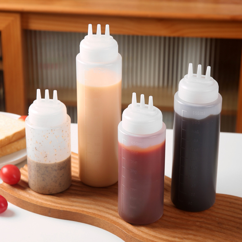Botella de salsa de ensalada de plástico, salsa de tomate de extrusión, botella de salsa de cocina doméstica de tres agujeros, botella de condimento de punta