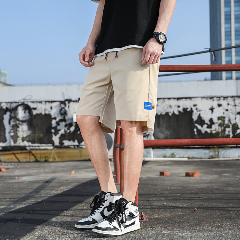 Pantalones de verano para hombres, pantalones cortos casuales de moda para hombres, pantalones de playa sueltos, fábrica directa.