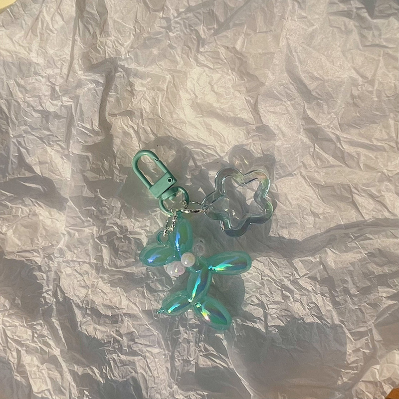 Pequeño Libro Rojo mismo lindo jalea globo láser perro llavero colgante colorido cachorro de dibujos animados teléfono llavero