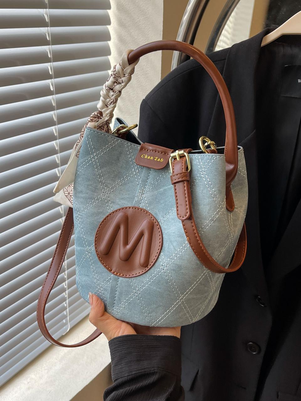 Bolso de cubo para mujer 2025 nuevo bolso de mano de estilo explosivo de color en contraste transfronterizo de moda bolso de mensajero de un solo hombro con textura de alta gama retro