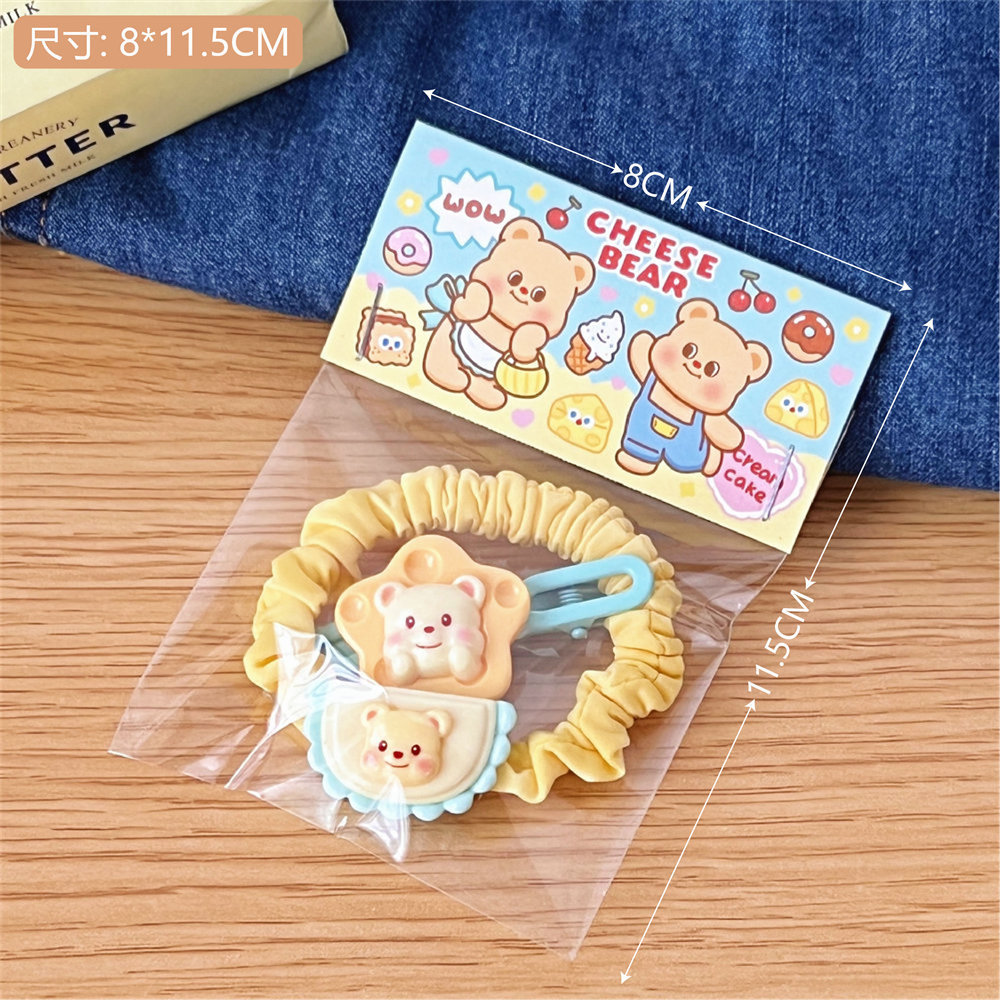 Mantequilla de crema oso anillo de cabello intestino grueso dibujos animados pequeña cuerda de cabeza fresca adornamiento de cabello macarón correa de alta elasticidad