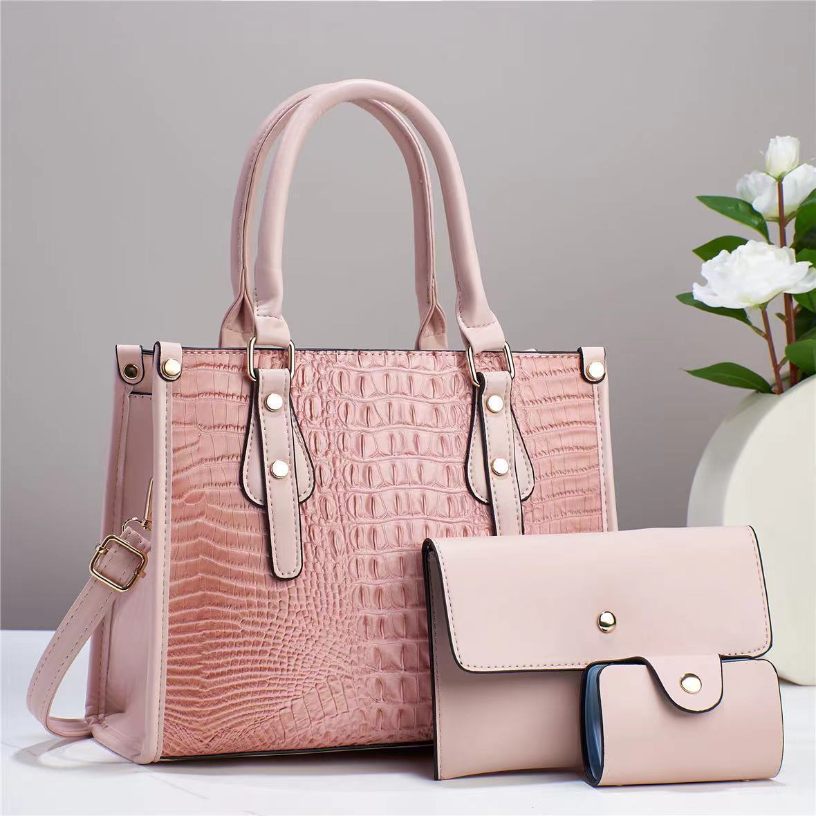Bolso de mujer de moda popular 2026 nuevo transfronterizo de tres piezas europeas y estadounidenses paquete de bolso de madre para mujeres de viaje universal mochila de hombro