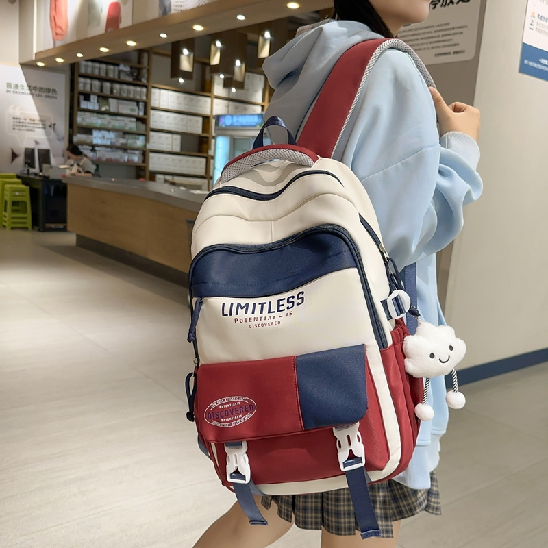 Mochilas escolares de alto valor facial nuevas estudiantes de primavera 2025 moda ligera y viajes al aire libre de gran capacidad con bolsos de hombro