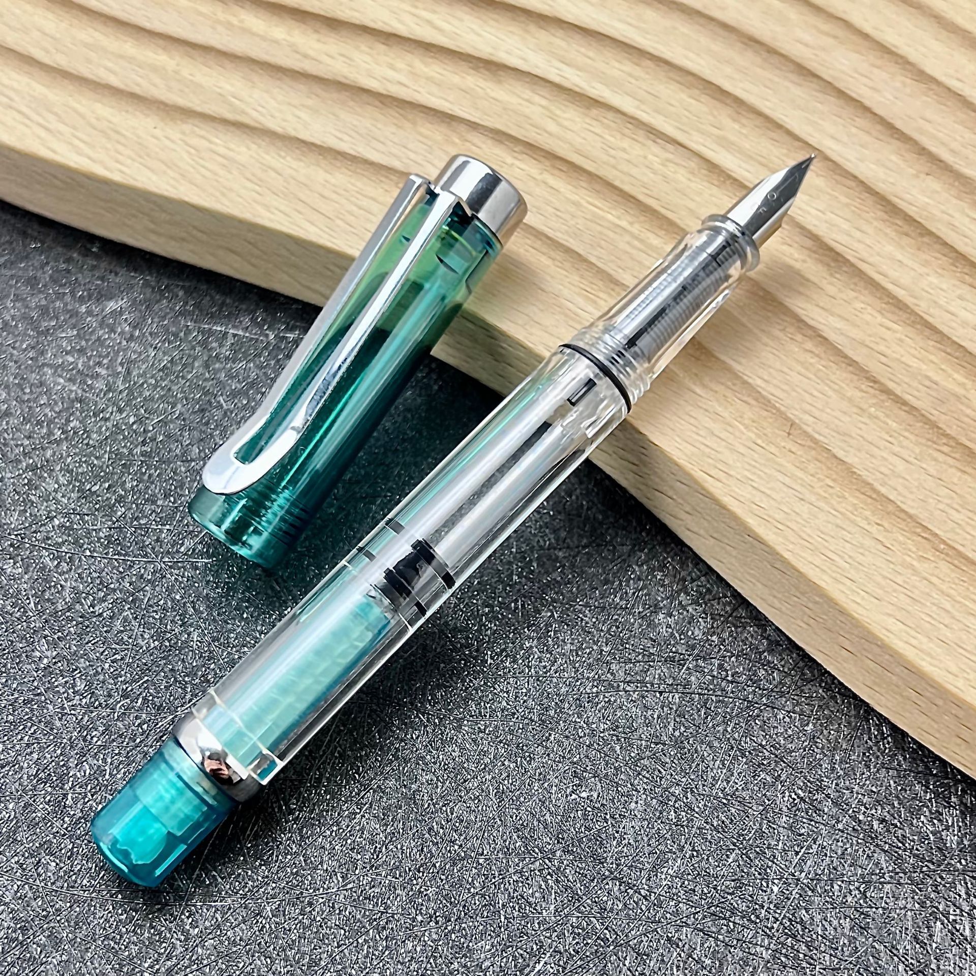 Ouguwen - Juego de regalo de papelería con bolígrafo de punta metálica giratoria de nuevo estilo, cartucho de tinta transparente que absorbe la tinta, para que los estudiantes practiquen la caligrafía.