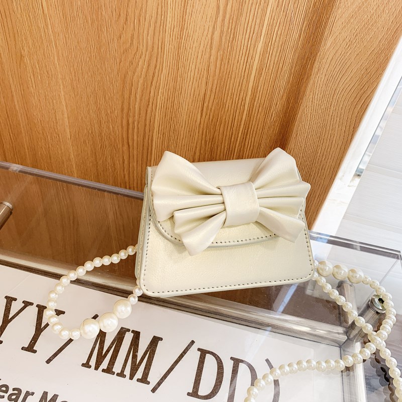 Coreano estilo extranjero mini niñas bolso de hombro lindo arco bebé mochila nueva moda bolso de cadena para niños