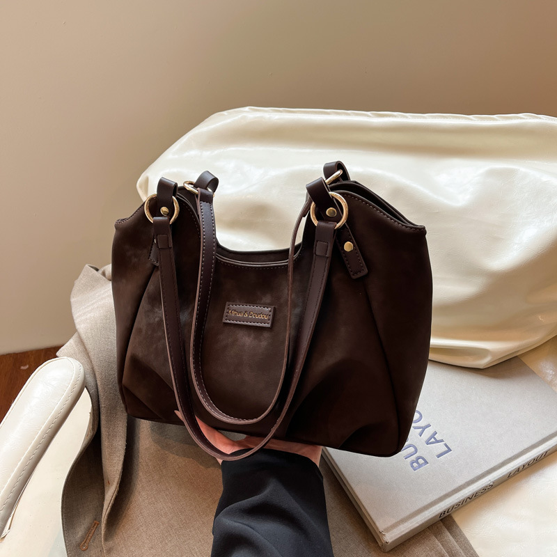 Bolsa de mano de peluche retro de gamuza para mujeres 2025 nueva moda versátil bolso de viaje tote bolso de hombro casual braza