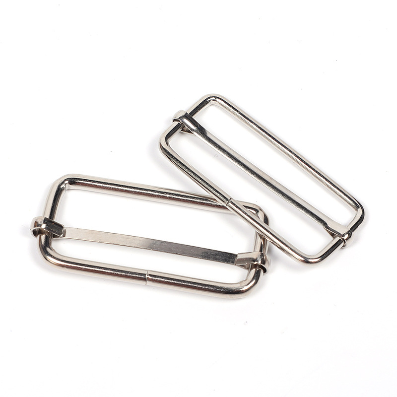 Fábrica de hardware en stock hebilla de metal hebilla de núcleo de tracción bolsa accesorios de ropa hebilla ajustable correa