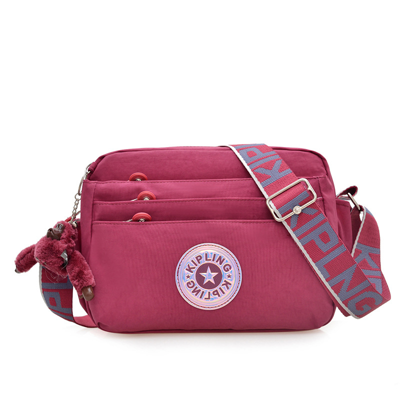 Nuevo bolso de hombro para mujer kp bolso de mensajero de tela de nailon anti-salpicaduras ultraligero nuevo colgante de mono estándar damas compras diagonales