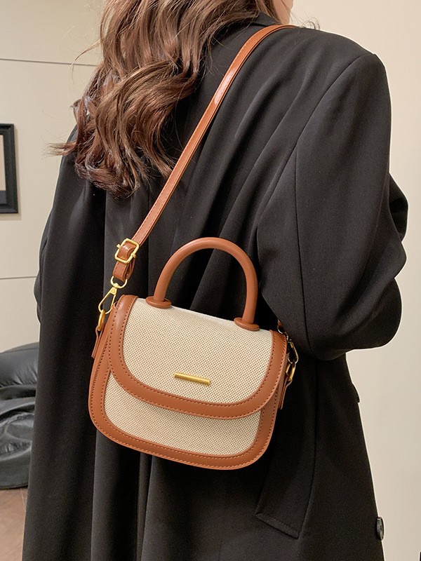 Bolsos de silla de mano de alta textura para mujeres 2026 nueva moda transfronteriza retro color contrastante empalme mochila de hombro