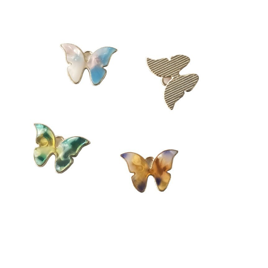 Transfronterizo Venta caliente accesorios de joyería de moda europea y americana DIY aleación resina color mariposa accesorios de joyería colgante único