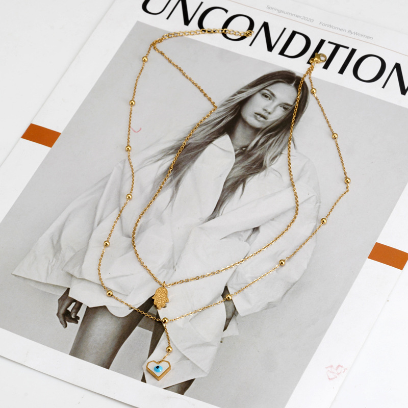 Retro Devilu0027S Eye Palm Heart Shape Titanium Steel Inlaid Shell Necklace