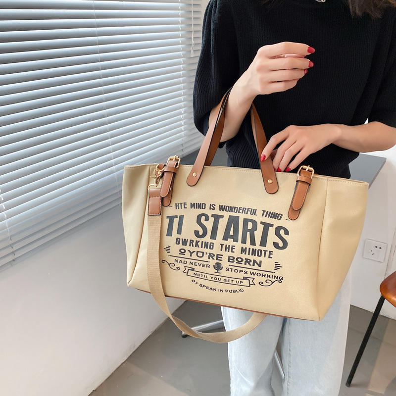 Bolso tote de lona estilo coreano 2025 con letras impresas, bolso de hombro cruzado, bolso tote versátil de gran capacidad.