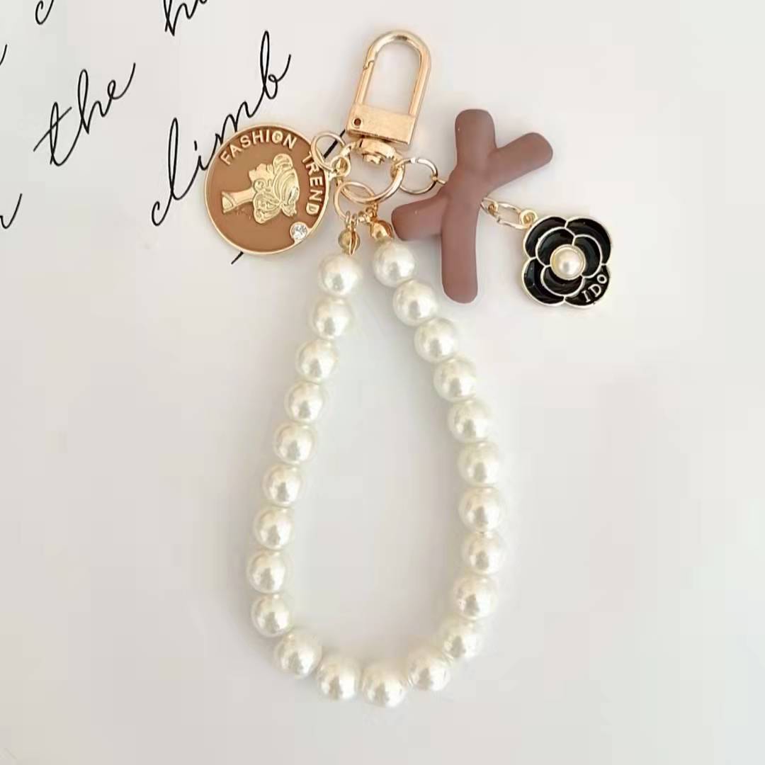 Japón y Corea del Sur color ins hecho a mano con cuentas flor llavero cordón de muñeca macaron color pétalo cordón de teléfono móvil en stock