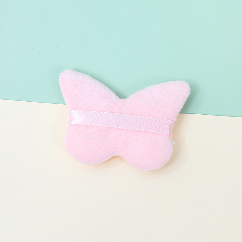 La borla de flocado corto en forma de mariposa transfronteriza no come polvo esponja de terciopelo de pie polvo suelto maquillaje maquillaje maquillaje algodón fábrica personalizado al por mayor