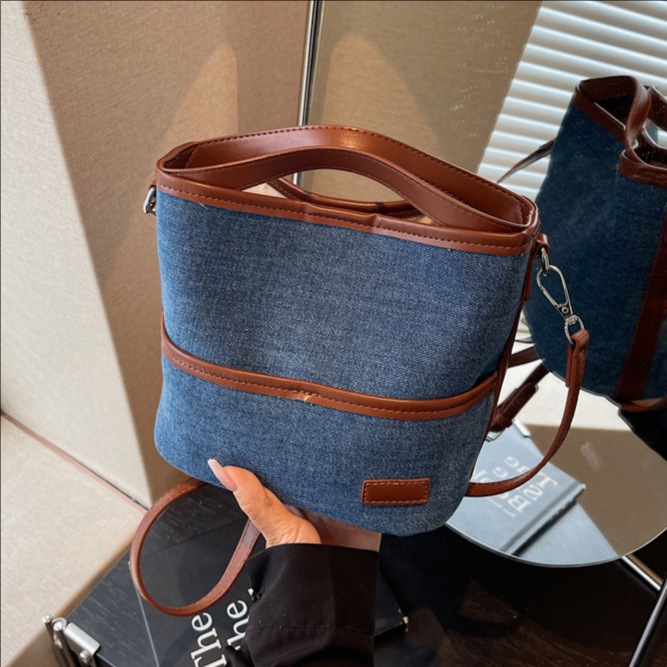 Bolso de mano transfronterizo popular bolso de cubo de agua mujer otoño / invierno 2025 nuevo estilo versátil bolso de hombro retro bolso coreano