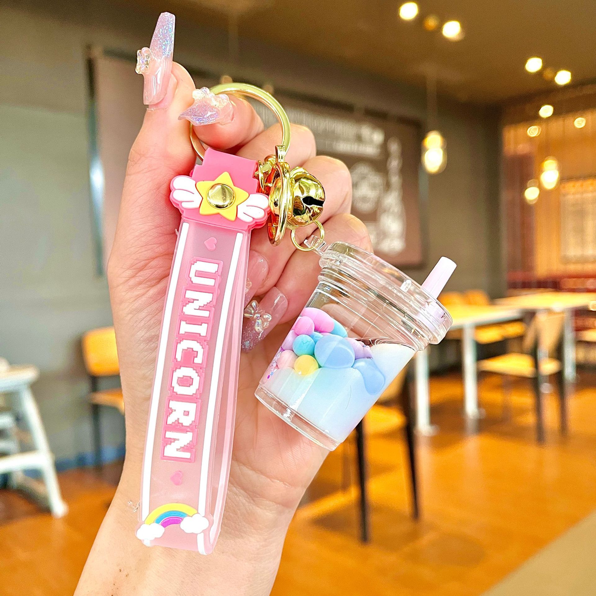 Aceite de gato garra arenas movedizas llavero lindo dibujos animados cadena colgante captura muñeca máquina agarrar pequeño regalo al por mayor