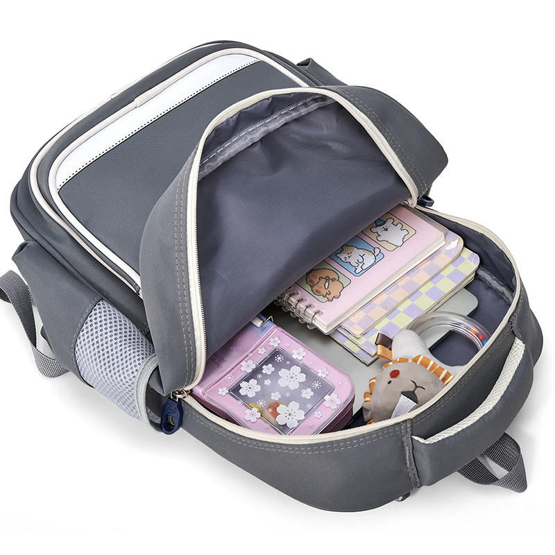 Mochila mayorista para estudiantes de primaria nueva mochila para niños y niñas de grado 1 - 3, mochila ligera para reducir la carga, mochila de ocio resistente al desgaste