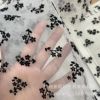 Ou Gentee Meloe implanted velvet A plum blossom fabric black implanted velvet net yarn spot color fabric