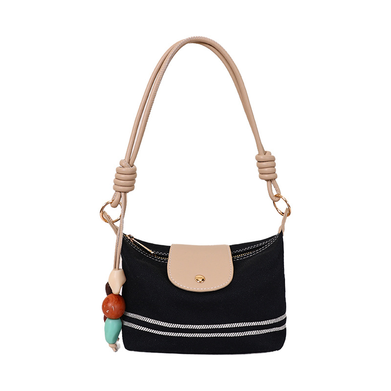 La versión coreana de nicho de diseño minimalista bolso de brazo para mujeres verano 2026 nuevo estilo extranjero versátil bolso de mochila casual diario