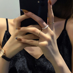 4-Piece Minimalist Ring Set in Cool Tone: Delicate Pearl Hoop Rings for Layered, Stackable Styling—Sleek Matte Gold Design, Trendy for Women