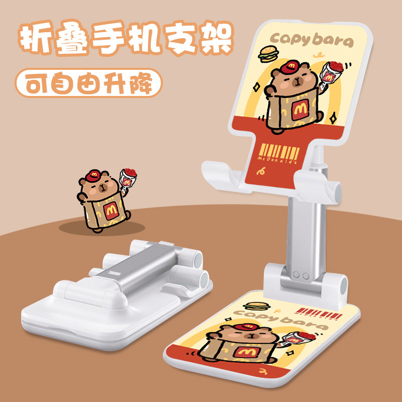 Kt猫の漫画の携帯電話の支柱はタブレットの怠け者のデスクトップの新型の生放送のネット課の神器のベッドの頭の折り畳みの支柱を適用します。|undefined