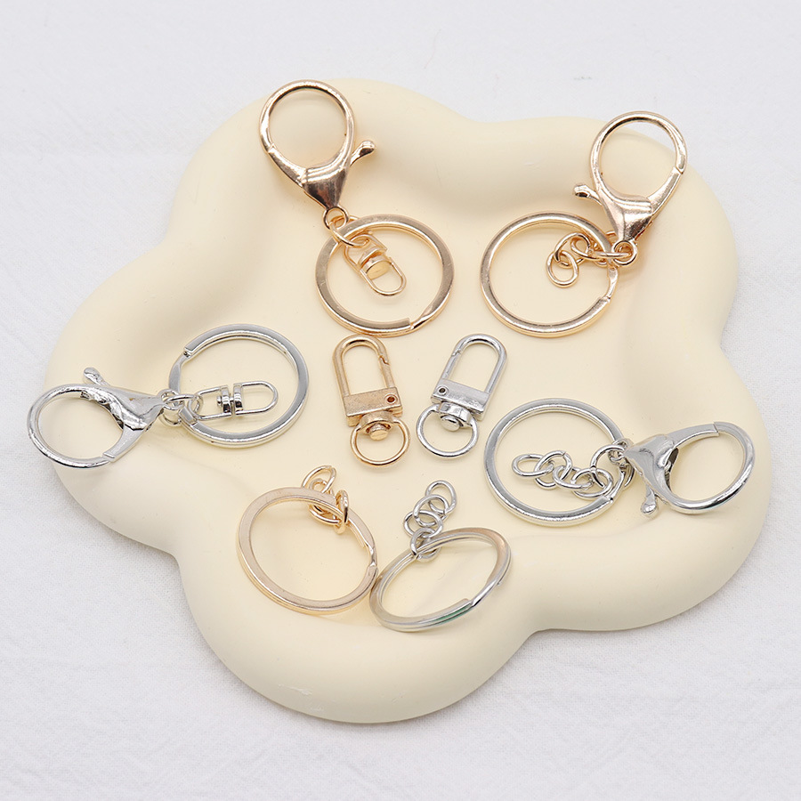 Fábrica al por mayor todo tipo de metal llavero accesorios de aleación langosta hebilla cadena hebilla 8-palabra llavero accesorios al por mayor