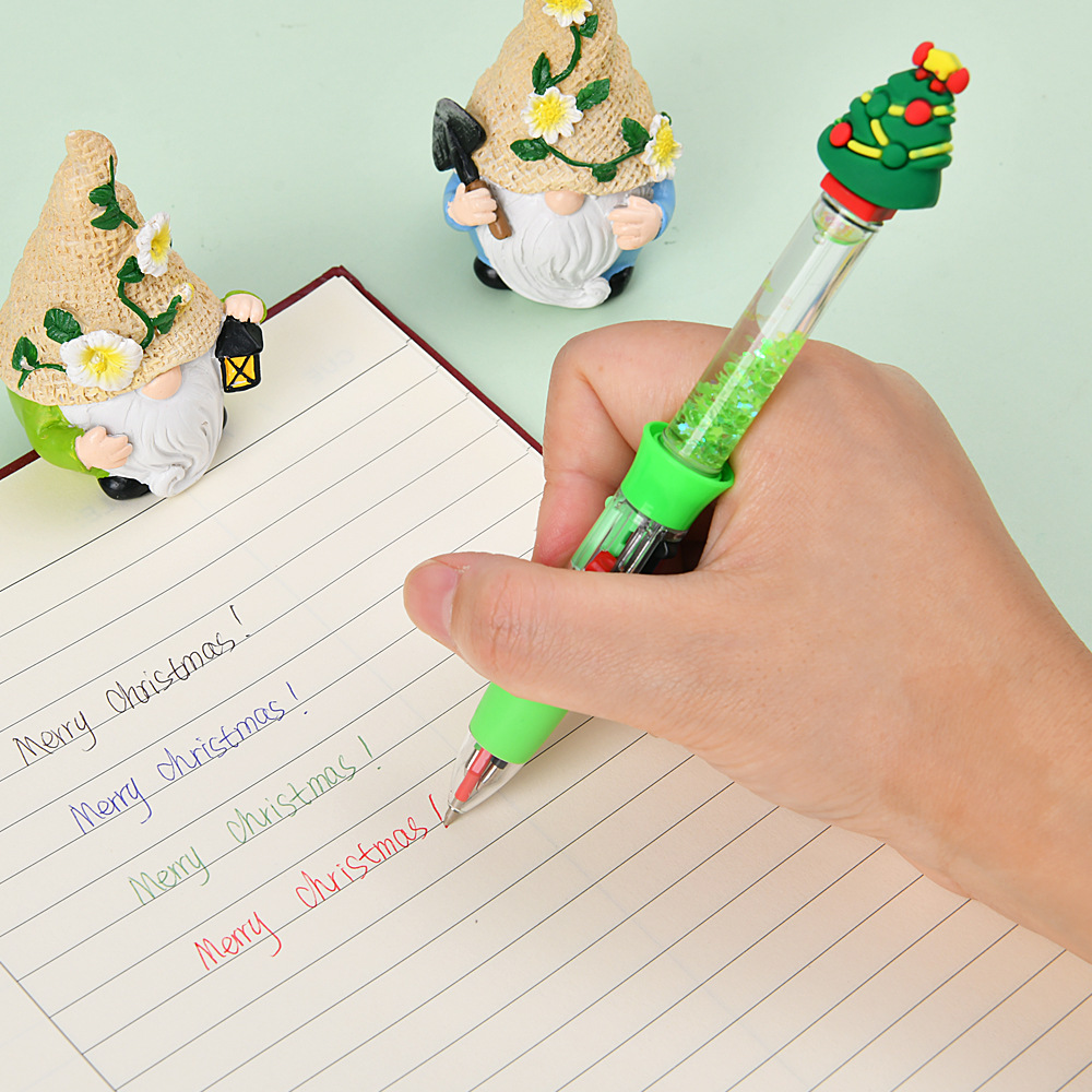 Navidad transfronteriza creativa encantadora dibujos animados de arena flotante mini bolígrafo de cuatro colores estudiantes papelería regalo al por mayor