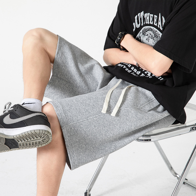 Pantalones cortos deportivos de punto de algodón chino 2025 nuevos productos de verano estilo básico calle sueltos pantalones de cinco puntos de marca de moda americana