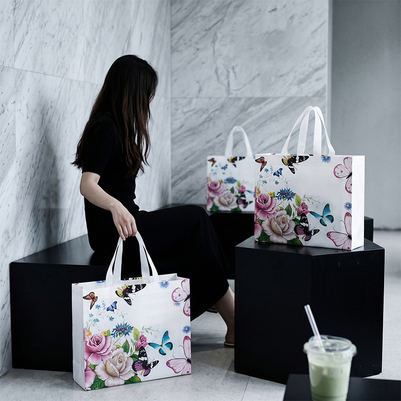 Bolsas de compras no tejidas al por mayor Bolsas de compras no tejidas recubiertas Bolsas de ropa logotipo personalizado al por mayor