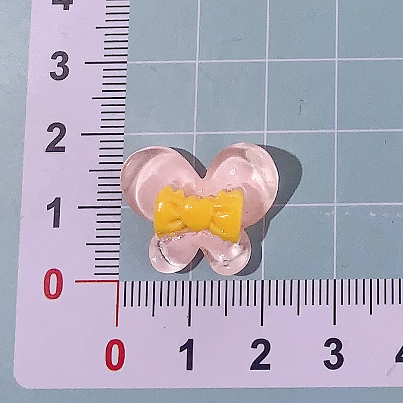 Nuevo color transparente mariposa arco DIY accesorios de resina pegamento crema caja de teléfono móvil adornamiento de pelo agujero material de parche de zapatos agujero