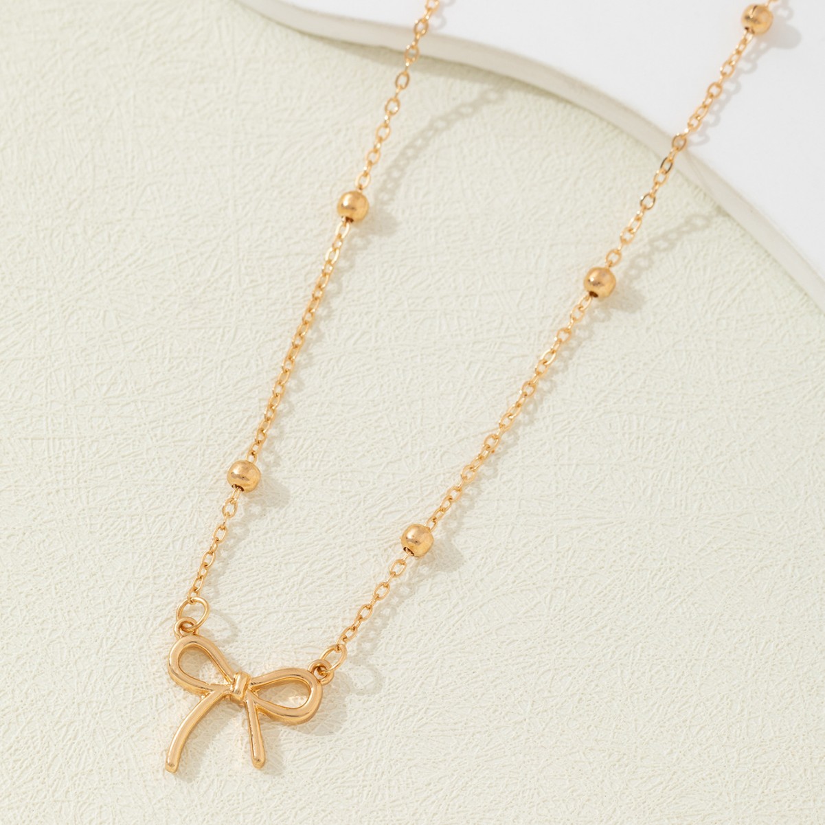 Collier pendentif nœud papillon en perles transfrontalières pour femme, chaîne ras du cou, style mignon, frais, simple et polyvalent, haut de gamme, vente en gros_voghion.com
